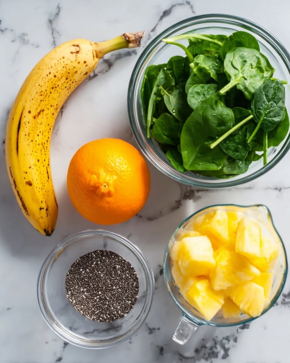 The image shows five items placed on a white marbled surface: a ripe yellow banana with brown spots on the left, a bright orange fruit next to the banana, a clear glass bowl with fresh green spinach leaves above the orange, a small clear bowl filled with black and white chia seeds below the orange, and a clear measuring cup filled with yellow pineapple chunks on the right side. photo taken with an iphone --ar 4:5 --v 7