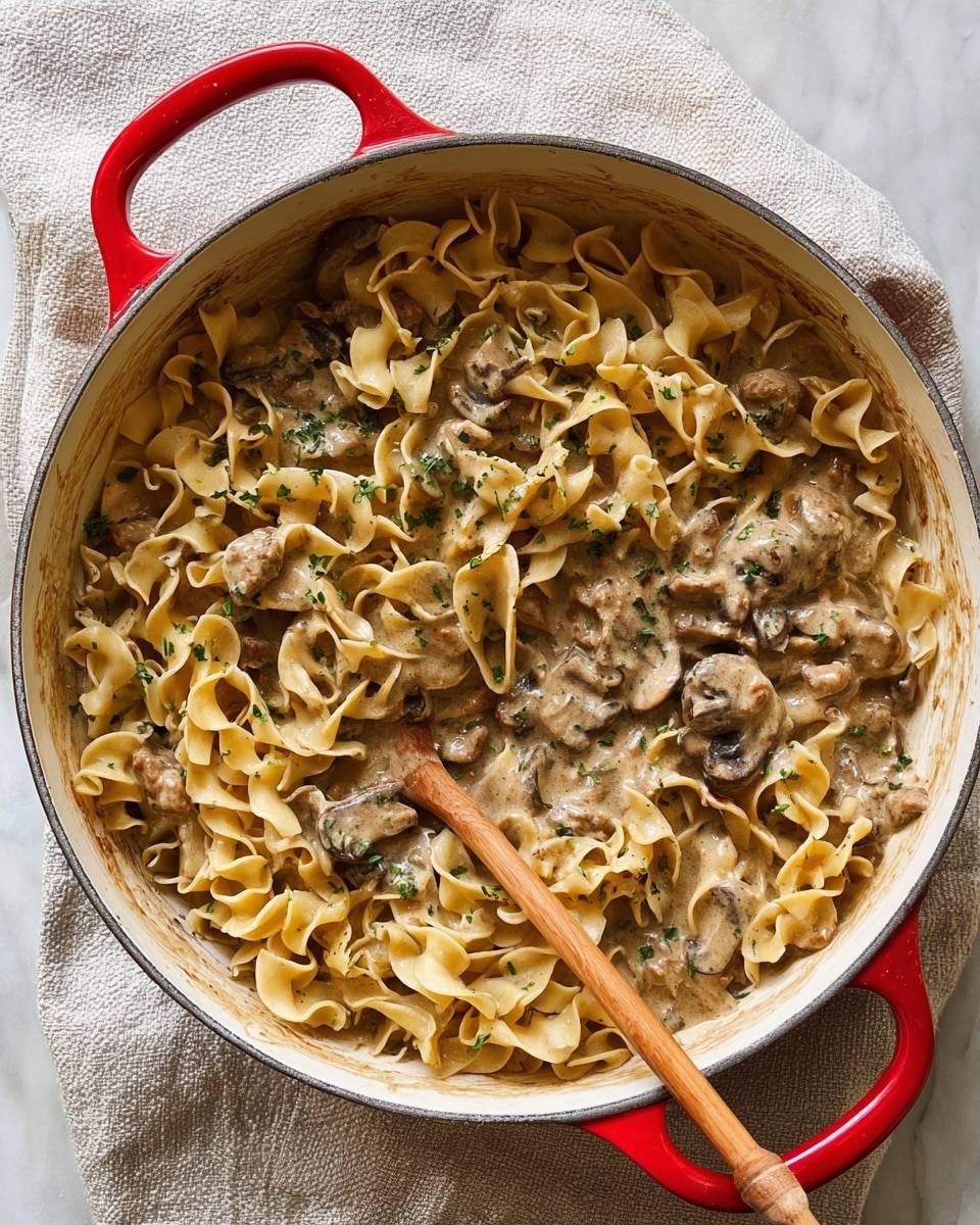 A white deep pan contains a bright yellow layer of melted butter with small bubbles rising on the surface, mixed with thin, light beige and pale pink slices of shallots spread unevenly across the pan. A wooden spoon with a light natural wood texture lies on the right side, partially immersed in the butter and shallots. The pan is placed on a white marbled surface with subtle grey veins. photo taken with an iphone --ar 4:5 --v 7