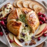 Brie en Croûte with Cranberries, Nuts, and Thyme Recipe
