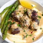Garlic Butter Steak Bites with Parmesan Cream Sauce & Cheesy Mashed Potatoes Recipe