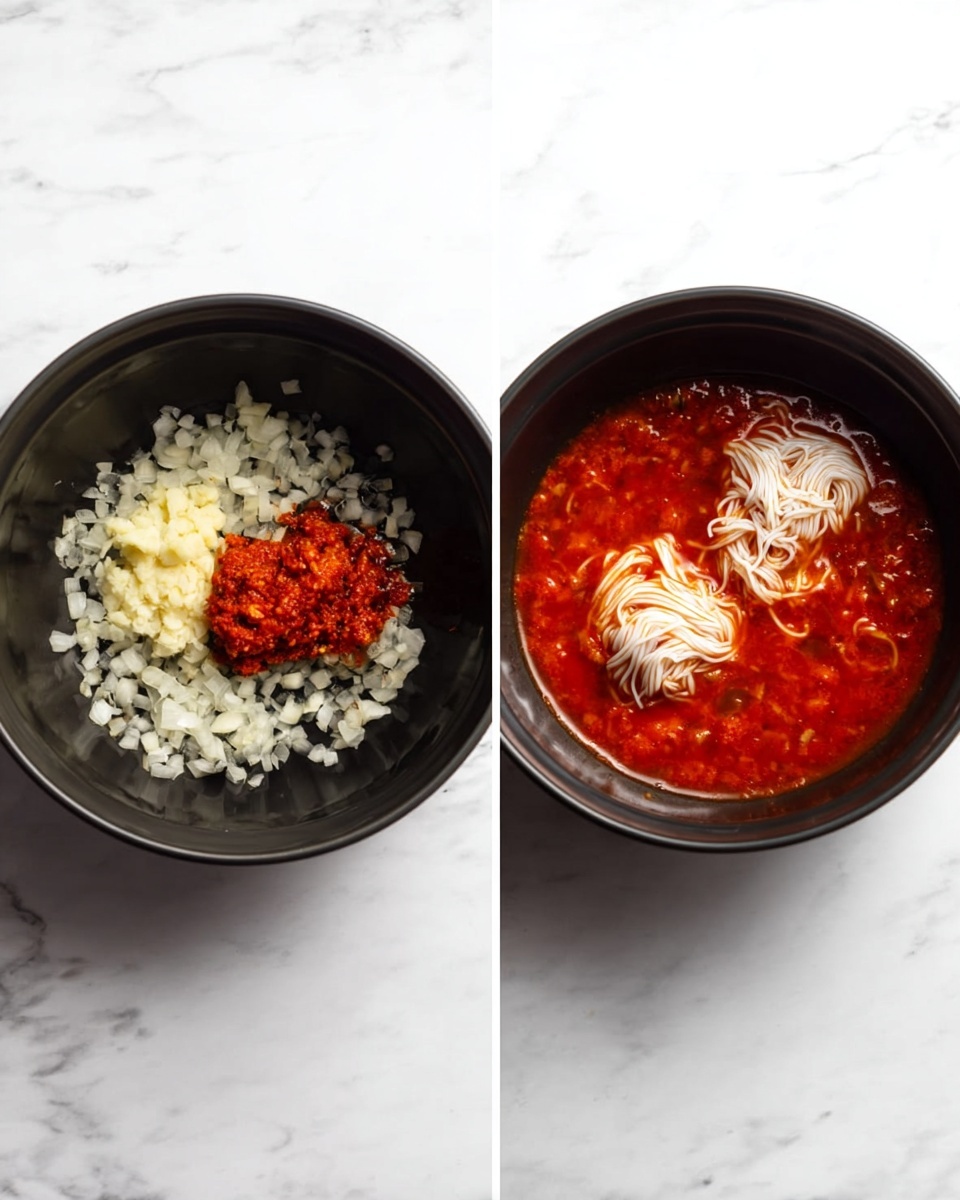 There are two black bowls placed side by side on a white marbled surface. In the left bowl, there is a mix of finely chopped white onions spread all over the base, along with a small mound of red paste and a small amount of grated pale yellow garlic on top. In the right bowl, there is a thick red sauce filling the bowl, with two bundles of white, thin noodles partially submerged in the sauce, placed close to each other near the center of the bowl. Photo taken with an iphone --ar 4:5 --v 7