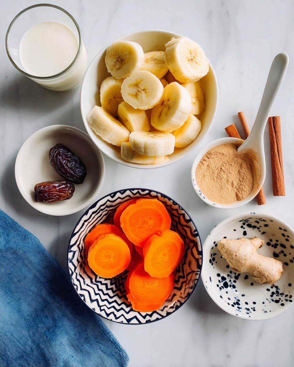 The image shows six containers with different ingredients arranged on a white marbled surface. In the center, there is a white bowl filled with thick slices of yellow banana. Below to the left is a bowl with a black zigzag pattern holding vibrant round slices of orange carrot. To the upper right, a white bowl holds two brown cinnamon sticks and a white ceramic spoon containing light brown powder. Below it to the right, a white bowl with a black splatter design has a piece of ginger root and a small wedge of ginger. Below that, a small plain white bowl holds one dark brown date. In the upper left corner, a clear glass container has a white liquid, and next to it on the marbled surface lies a folded blue cloth. Photo taken with an iphone --ar 4:5 --v 7
