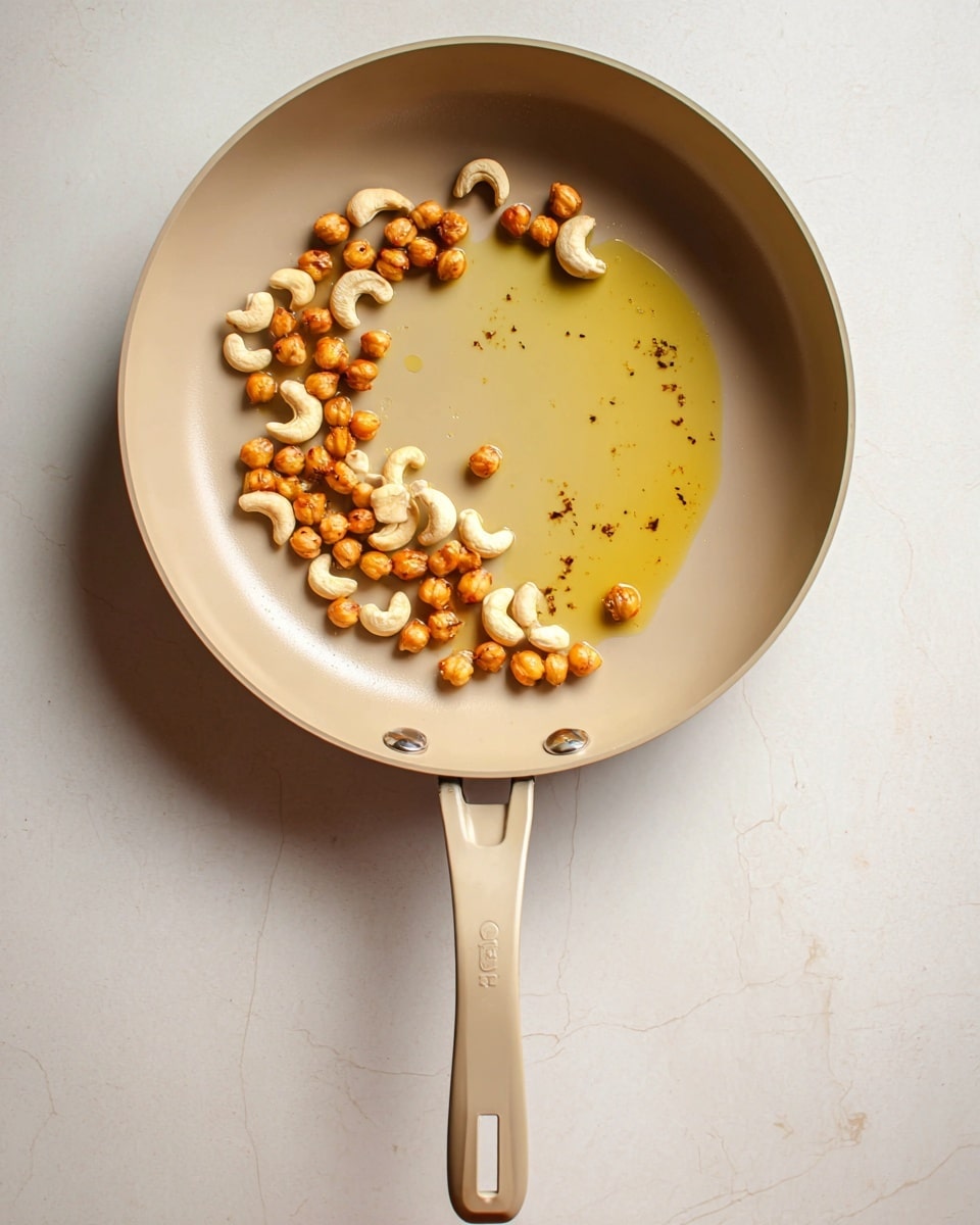 A round black bowl filled with one thick layer of bright orange grated carrots that are fluffy and piled loosely up to the rim of the bowl, sitting on a white marbled surface photo taken with an iphone --ar 4:5 --v 7