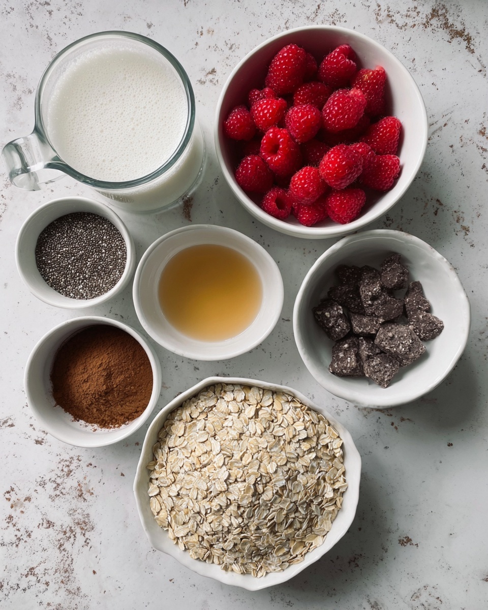 The image shows seven small white bowls and a glass measuring cup arranged on a white marbled surface. Starting from the top right and moving clockwise, there is a white bowl filled with fresh red raspberries. Below it, a white small bowl holds a small amount of golden-colored liquid. Next to it, a white bowl contains dark brown powder with chunks. Below that, another white bowl holds a light brown liquid. To the left of it, a white measuring cup is filled with tiny black and white chia seeds. Above it, a small white bowl has a small pile of finely ground coffee-colored powder. To the top left, a glass measuring cup is filled with a foamy white liquid that reaches almost to the top. At the center is a larger white bowl full of light beige oats. photo taken with an iphone --ar 4:5 --v 7
