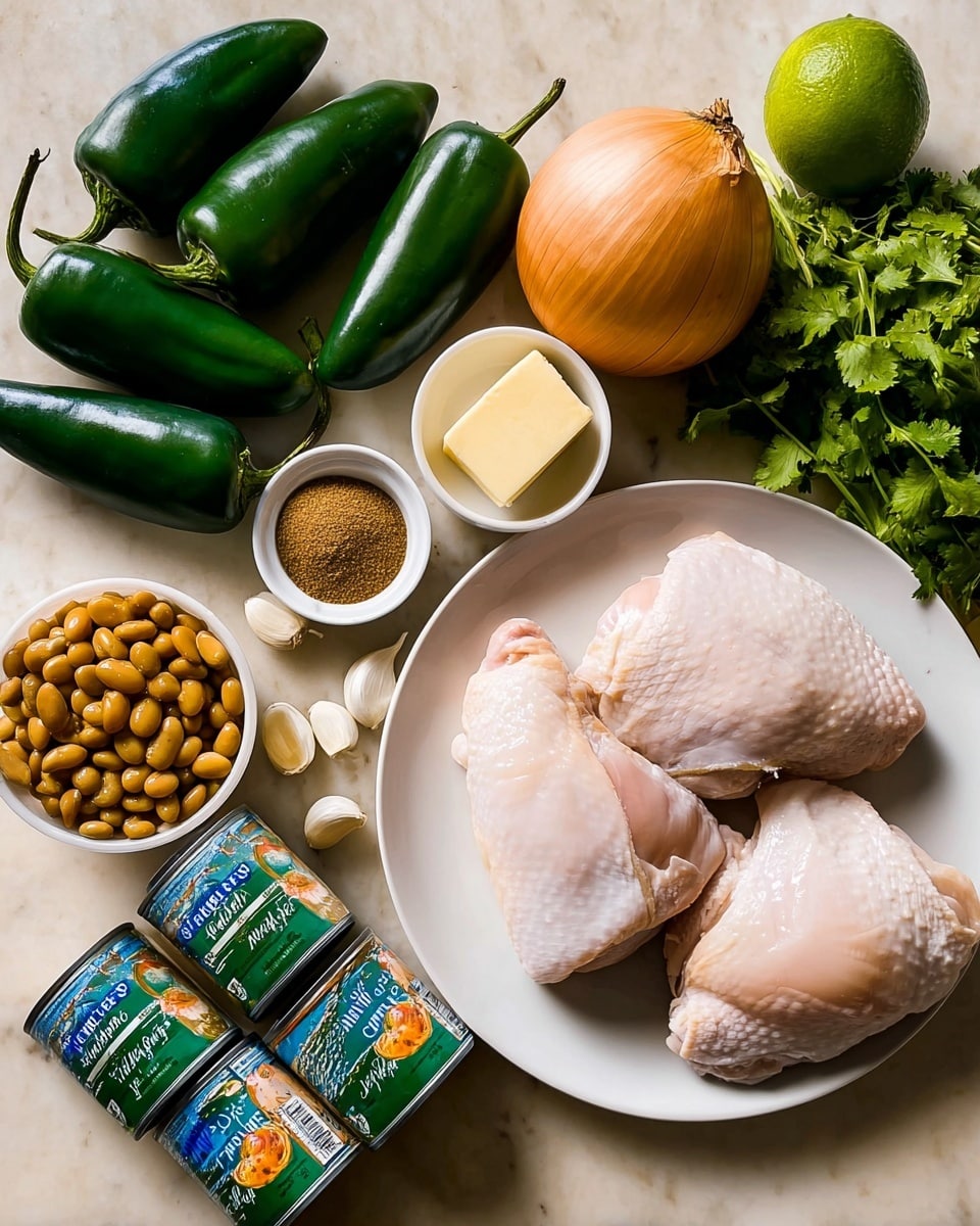 The image shows a white round plate on the right side with two raw chicken thighs, light pink with a smooth shiny texture and some white fat skin covering parts of the thighs. To the left of the plate, there are four dark green poblano peppers with a slightly wrinkled and shiny surface, arranged in a loose cluster. Above the peppers is a medium brown onion with a smooth surface and above that a bunch of fresh bright green cilantro leaves. Near the top left corner, there are several peeled garlic cloves with a smooth off-white color, next to a small white bowl containing a pale yellow butter slab. Below are two small white bowls stacked, one filled with brown ground spices and below it a whole lime with a bright green texture. On the bottom left, there are four cans lying on their sides with colorful labels: two blue cans of green chiles and two green cans of white cannellini beans. The surface is a white marbled texture. Photo taken with an iphone --ar 4:5 --v 7