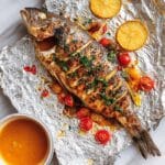 Whole Baked Sea Bass with Herb Marinade and Cherry Tomatoes Recipe