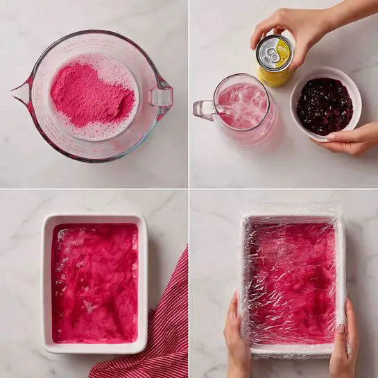 The image shows four steps of making a layered dessert on a white marbled surface. The first step is a mound of bright pink powder next to a clear measuring cup pouring water, creating a foamy pink liquid base. The second step shows a woman's hand holding an open can of light yellow crushed pineapple over the pink foam. The third step features a woman’s hand holding a small white bowl filled with thick, dark red berry sauce above the pink foam background. The last step is a white rectangular dish filled with a pink frothy layer covered with clear plastic wrap. A red and white cloth is partly visible in the corner of the surface. Photo taken with an iphone --ar 4:5 --v 7