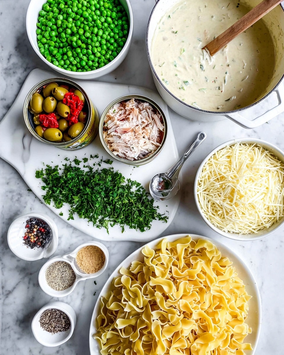 The image shows layer of light yellow cooked pasta in a white colander at the bottom right corner; above the pasta is a white cutting board with fresh green parsley spread across it, and two open cans of light beige tuna next to a silver scoop filled with sliced green olives and small red peppers; to the top left of the cutting board is a white bowl filled with bright green peas, and next to it a pot of thick creamy white sauce with a wooden spoon resting inside; at the top right corner, there are two white bowls, one overflowing with shredded white cheese and the other with a fine beige powder; small white bowls at the bottom left contain ground black pepper and white salt; all are placed on a white marbled surface photo taken with an iphone --ar 4:5 --v 7