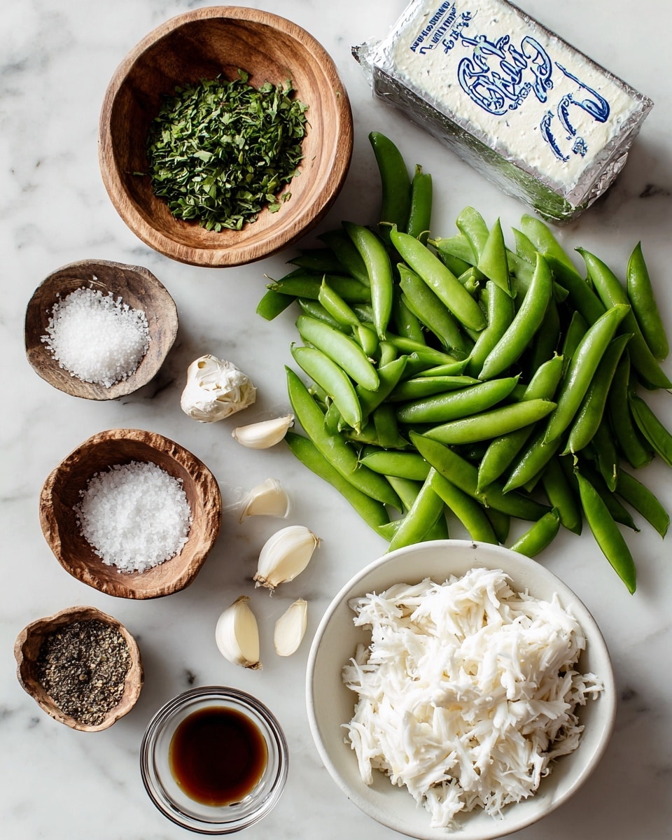 The image shows several fresh ingredients arranged neatly on a white marbled surface. There is a white bowl filled with shredded white crab meat in the bottom right corner. Next to it, a pile of bright green snap peas is spread out, forming a loose bed for the other items. Above the snap peas, a small wooden bowl is filled with chopped green herbs, with a few herb pieces scattered nearby. A block of wrapped cream cheese sits near the center with blue writing on the silver foil. To the left, another small wooden bowl holds coarse black pepper, and just above it is a similar bowl containing white sea salt. Below the pepper bowl are three garlic cloves and a small clear bowl with minced garlic. Finally, a tiny clear bowl containing a small amount of dark brown liquid, likely soy sauce or vinegar, completes the setup. The photo taken with an iphone --ar 4:5 --v 7