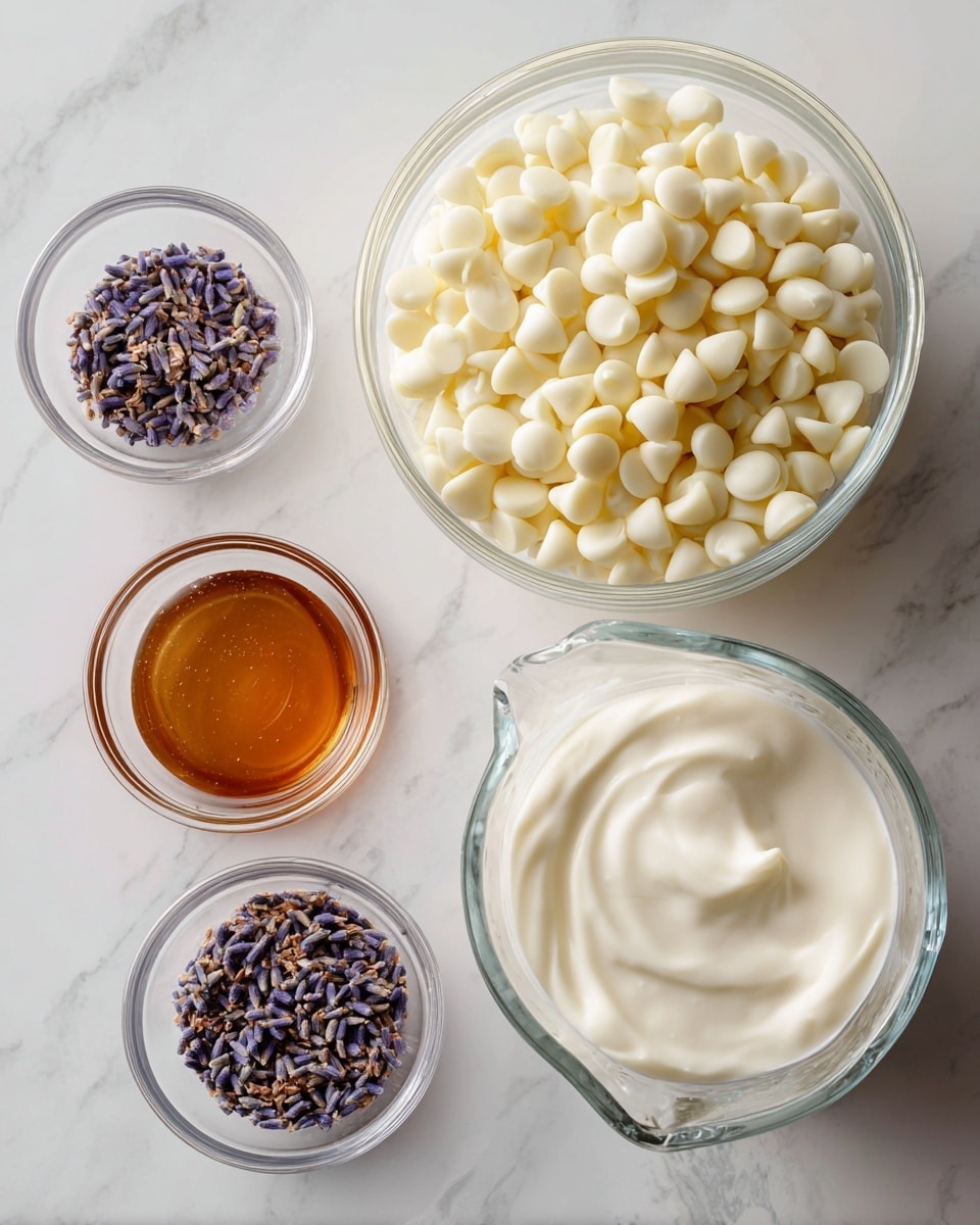 This image shows four clear glass bowls with different ingredients on a white marbled surface. The largest bowl is at the top right, filled with many small, smooth, white chocolate chips. Below it to the right, there is a medium glass measuring cup filled with thick white cream. To the left of the cream, a small clear bowl holds a light brown, shiny liquid, likely honey or syrup. The smallest bowl, at the bottom left, contains tiny dried lavender buds in shades of purple and light brown. All bowls are neatly arranged with space around them and viewed from above. photo taken with an iphone --ar 4:5 --v 7