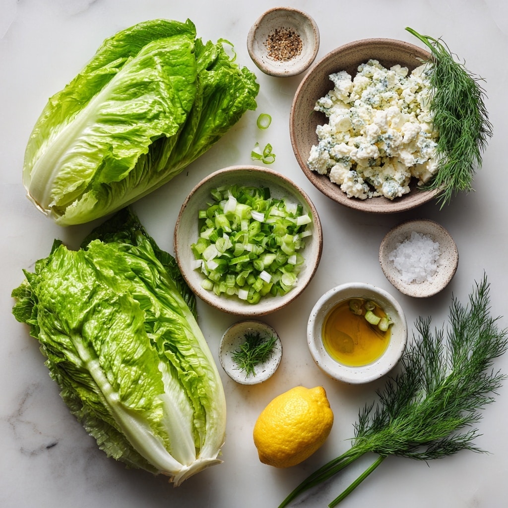 A large wooden bowl filled with a fresh green salad made of shredded lettuce mixed with small pieces of white cheese and finely chopped herbs, creating a light and textured layer of greens with white and green specks throughout. Two long wooden salad tongs with a natural carved pattern rest inside the bowl on the right side. To the top left of the bowl, a white ceramic plate holds two round lemon slices and a bunch of fresh dill, adding a yellow and green contrast. The entire setup is placed on a folded white and gray striped cloth over a white marbled surface. Photo taken with an iphone --ar 4:5 --v 7