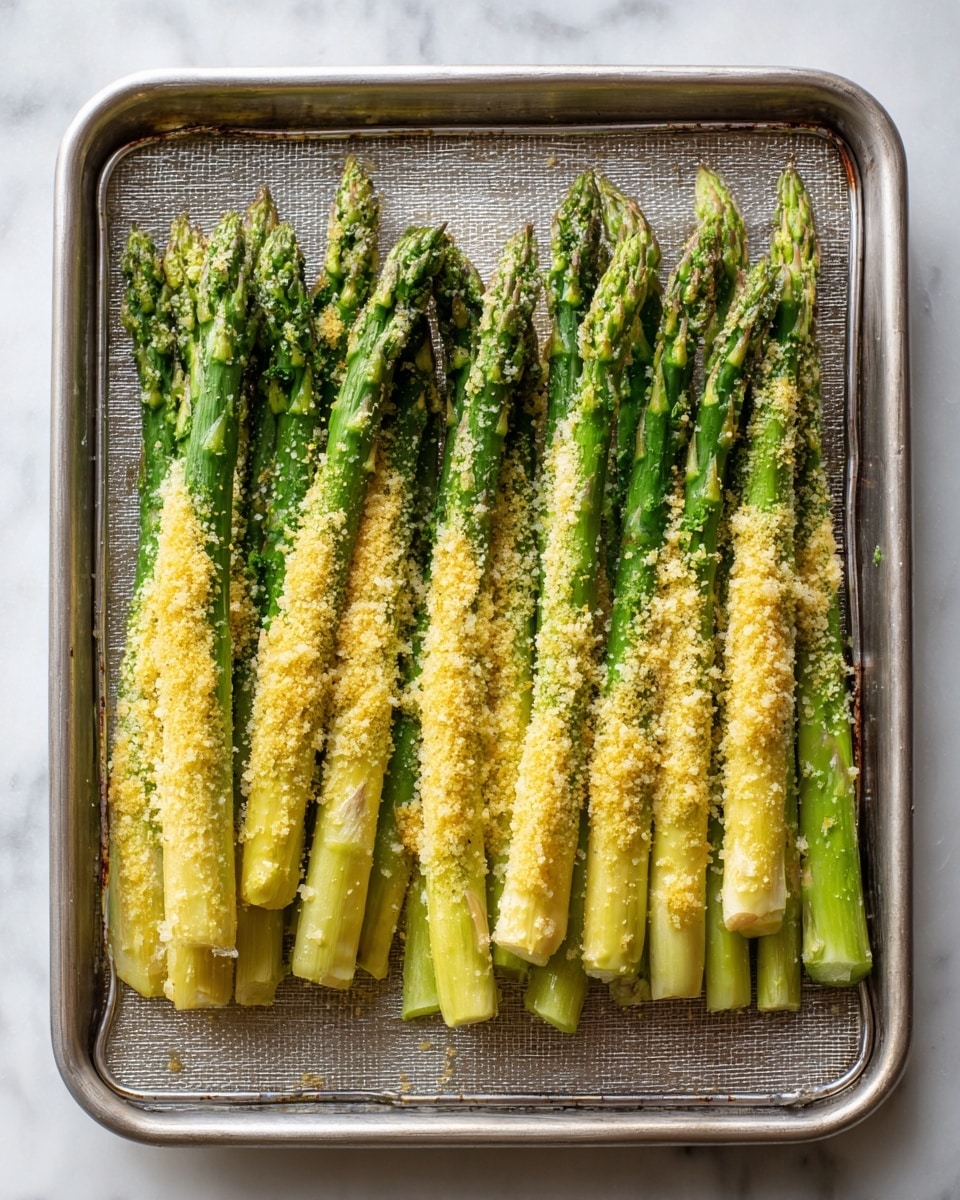 A clear glass bowl sits in the center on a white marbled surface, filled with three visible layers: the bottom layer is a smooth creamy white, the middle layer is a bright yellow sauce that looks thick and glossy, and the top layer is a light sprinkling of finely grated yellow zest and a small pile of light brown powder. A silver spoon with a detailed handle rests inside the bowl. To the left of the bowl is a metal grater with fine holes, and above it is an open jar filled with a beige creamy paste. Next to the jar is a small clear container with a slightly darker beige powder inside and its open metal lid beside it. Above the bowl is a bright yellow and green lemon squeezer holding half a lemon, and next to it sits another lemon half with visible seeds. On the right side, there is a small wooden bowl placed on the white marbled surface. photo taken with an iphone --ar 4:5 --v 7