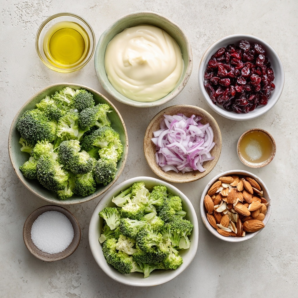 The picture shows three steps of making a salad dressing and salad in stainless steel and white bowls on a white marbled surface. In the first frame, a stainless steel bowl has thick white cream, sprinkled black pepper, and a whisk inside. In the second, the same bowl with the whisk holds a smooth, creamy, off-white liquid dressing. The third frame shows a white bowl filled with bright green broccoli pieces, chopped purple onions, red dried cranberries, orange crispy bacon bits, and brown sliced almonds, with two wooden spoons resting inside the bowl. Photo taken with an iphone --ar 4:5 --v 7