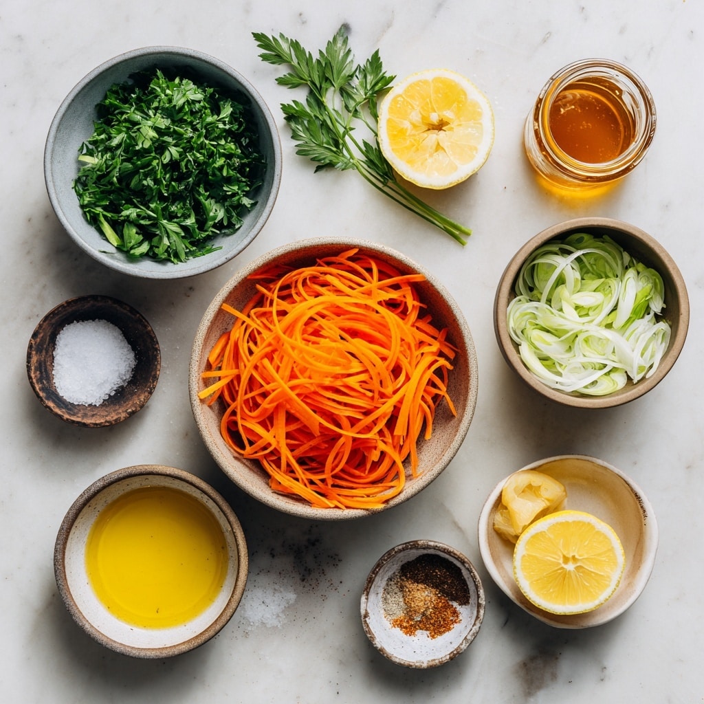 A clear glass bowl sits on a white marbled surface, filled with thin, bright orange carrot sticks forming the base layer. On top of the carrot sticks, there is a small heap of finely chopped dark green herbs near the bottom center, and above that, a small pile of light green and white sliced green onions. To the right, a glass container with a yellow dressing mixed with black pepper is being poured into the bowl. photo taken with an iphone --ar 4:5 --v 7