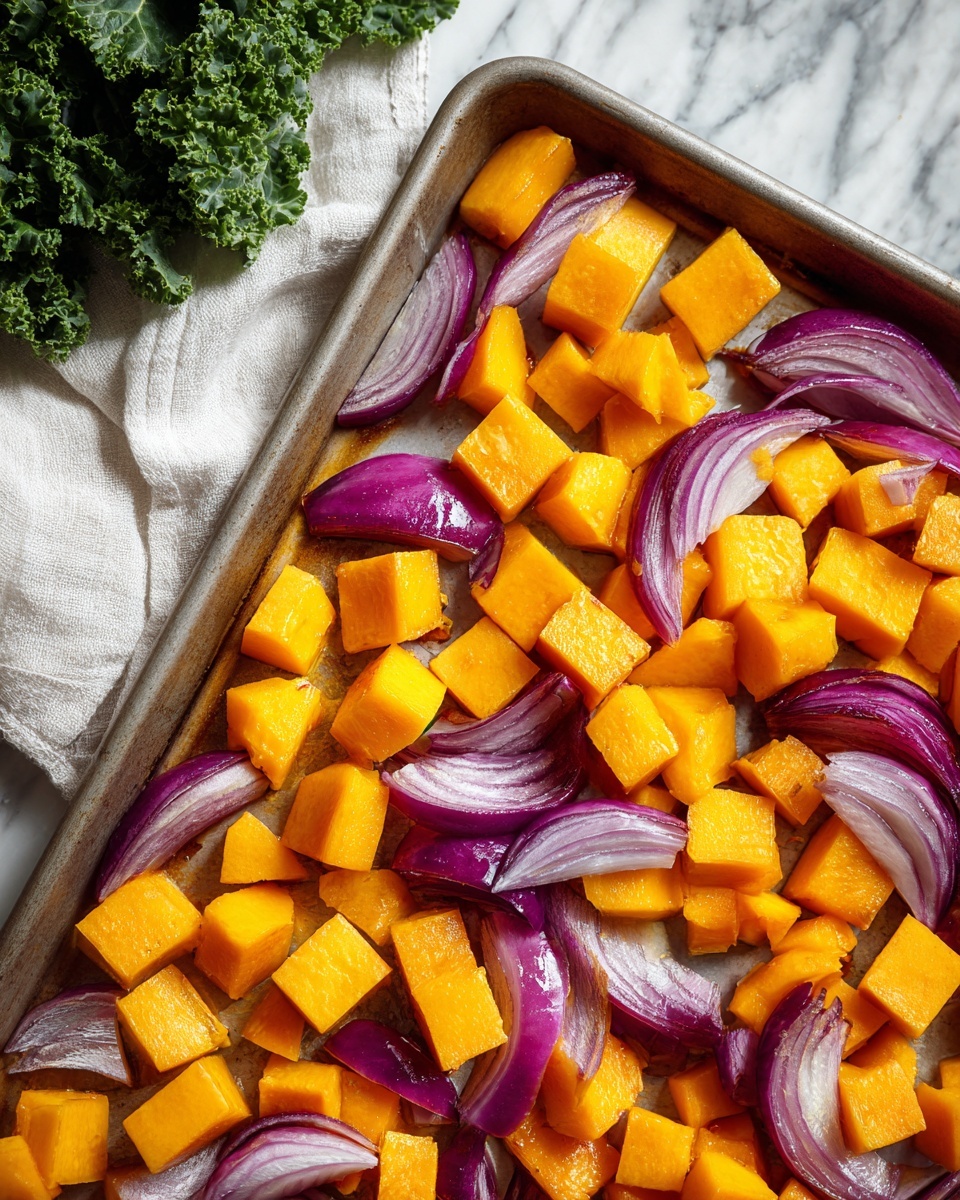 The image shows a baking tray with two layers of cut vegetables on a white marbled surface. The bottom layer covers most of the tray and consists of small, bright orange-yellow cubes of butternut squash with a smooth texture. Above this, near the top edge, are slices of purple-red onion, cut into thick quarter wedges, with a shiny, slightly translucent texture showing the white inner flesh. In the top-left corner, green leafy kale rests on a white cloth, adding a contrasting rough texture and dark green color to the composition. Photo taken with an iphone --ar 4:5 --v 7