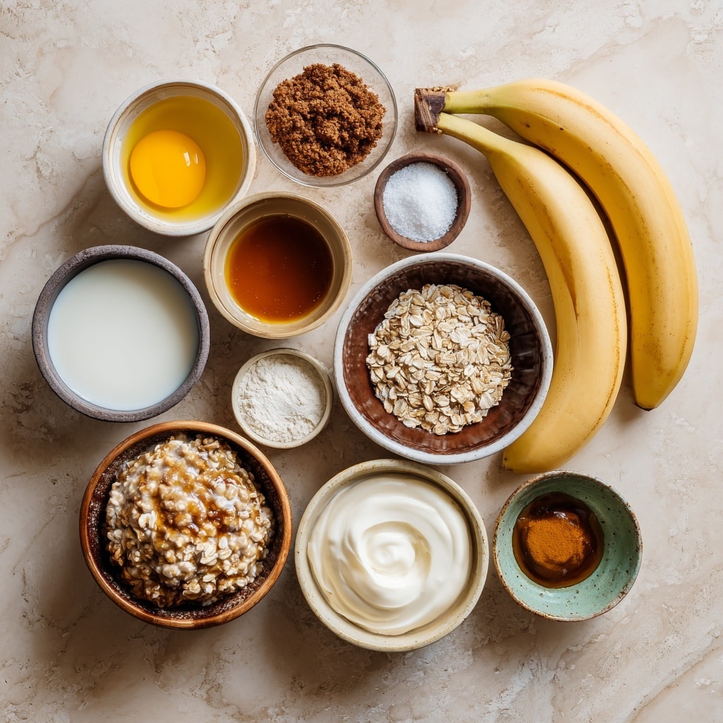 A gray pan is shown on a white marbled surface with a striped cloth nearby. Inside the pan, there are fourteen small, round slices of plantain, golden brown in color with a caramelized texture, arranged loosely across the bottom. The pan's surface catches the light, showing shiny cooked oil around the plantains. On the left side outside the pan, part of a white bowl with a smooth dollop of cream or yogurt is visible. The photo is taken with an iphone --ar 4:5 --v 7