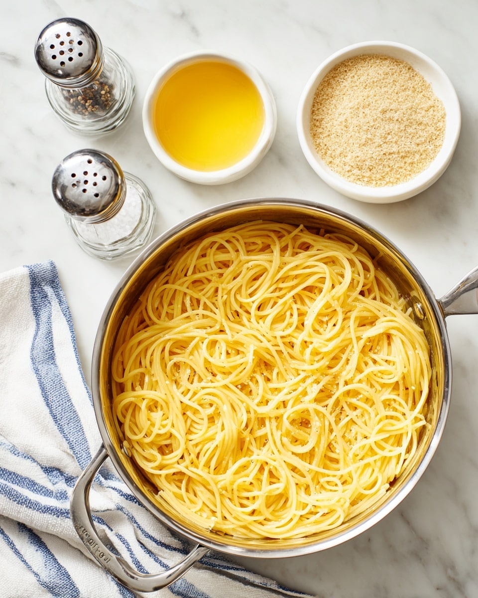 A large silver pot filled with cooked yellow egg noodles sits on a white marbled surface. Above the pot, there is a white small bowl filled with golden melted butter and a white bowl filled with light brown breadcrumbs. To the top left of the pot, there are two glass shakers with silver tops, one filled with black pepper and the other with salt. A white and blue striped cloth is partially visible on the bottom left side of the image. Photo taken with an iphone --ar 4:5 --v 7