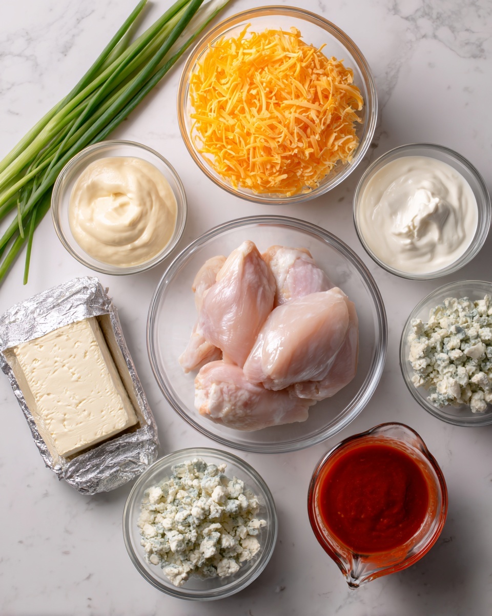 The image shows a white marbled surface with several clear glass bowls and a glass measuring cup arranged neatly as ingredients. In the center, there is a clear glass bowl with three raw, pale pink chicken pieces stacked inside. Above it to the left is a bowl filled with bright orange shredded cheese, next to it is a bowl of white sour cream, and then a bowl with a light beige creamy sauce. To the bottom left, there is a bowl with pale blue crumbled cheese, and beside it is a rectangular block of silver-wrapped cream cheese. Finally, at the bottom right, there is a glass measuring cup filled with bright red buffalo sauce. In the top left corner, two long green onion stalks lie on the white marbled surface. photo taken with an iphone --ar 4:5 --v 7
