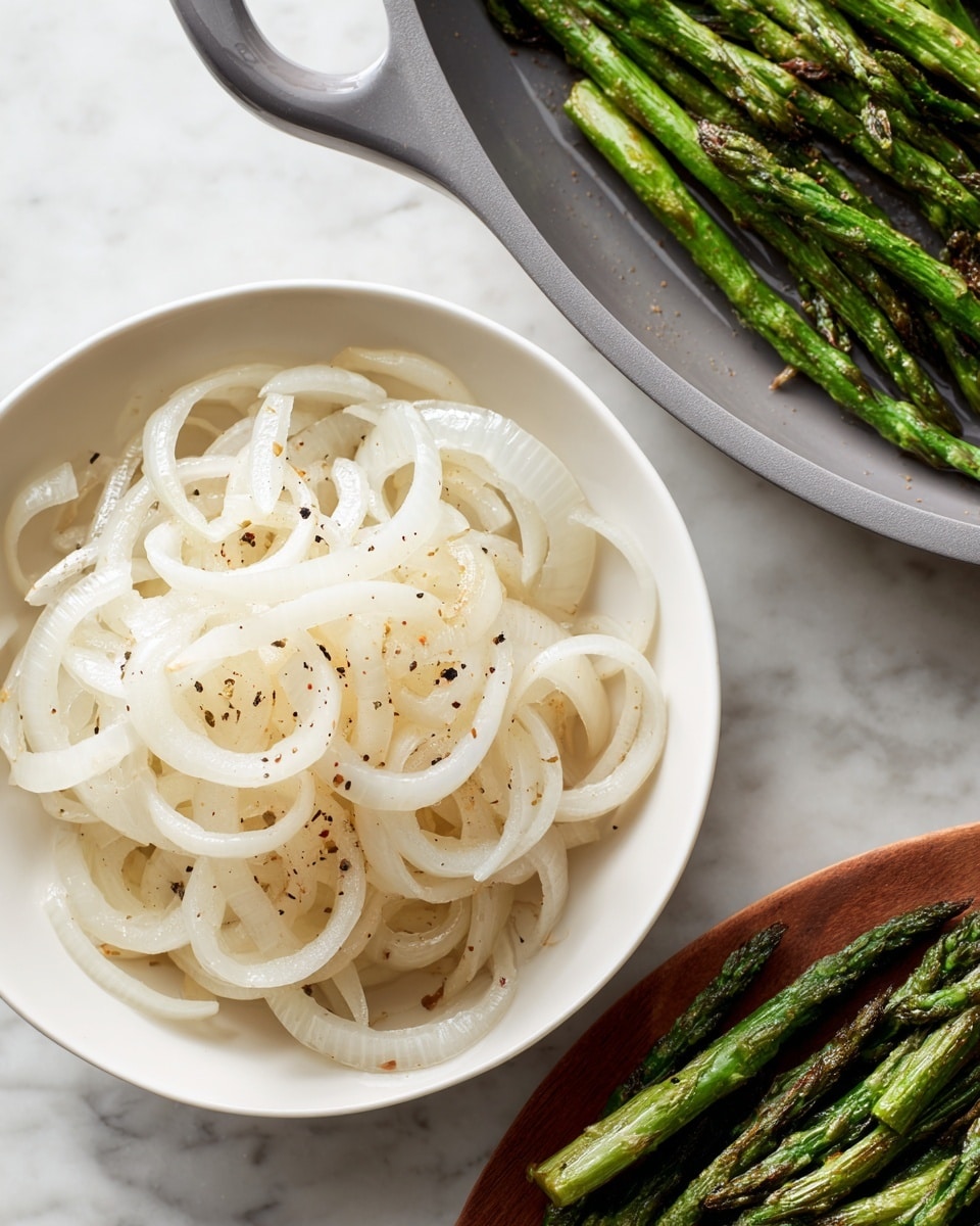 On a white oval plate with blue zigzag patterns, there is a layered dish starting with a base of vibrant green asparagus spears scattered across the plate. On top, there are thick slices of pale green avocado arranged in the center. Thin white onion slices are spread over the asparagus and avocado. The dish is richly topped with a creamy light beige sauce drizzled all over, followed by a generous sprinkle of crunchy brown crumbs. Fresh green dill sprigs are scattered across, adding a touch of freshness. Two lemon wedges with bright yellow flesh are placed neatly on one side of the plate. The whole scene sits on a white marbled surface, with a glass of amber-colored liquid and a lemon wedge visible nearby. Photo taken with an iphone --ar 4:5 --v 7