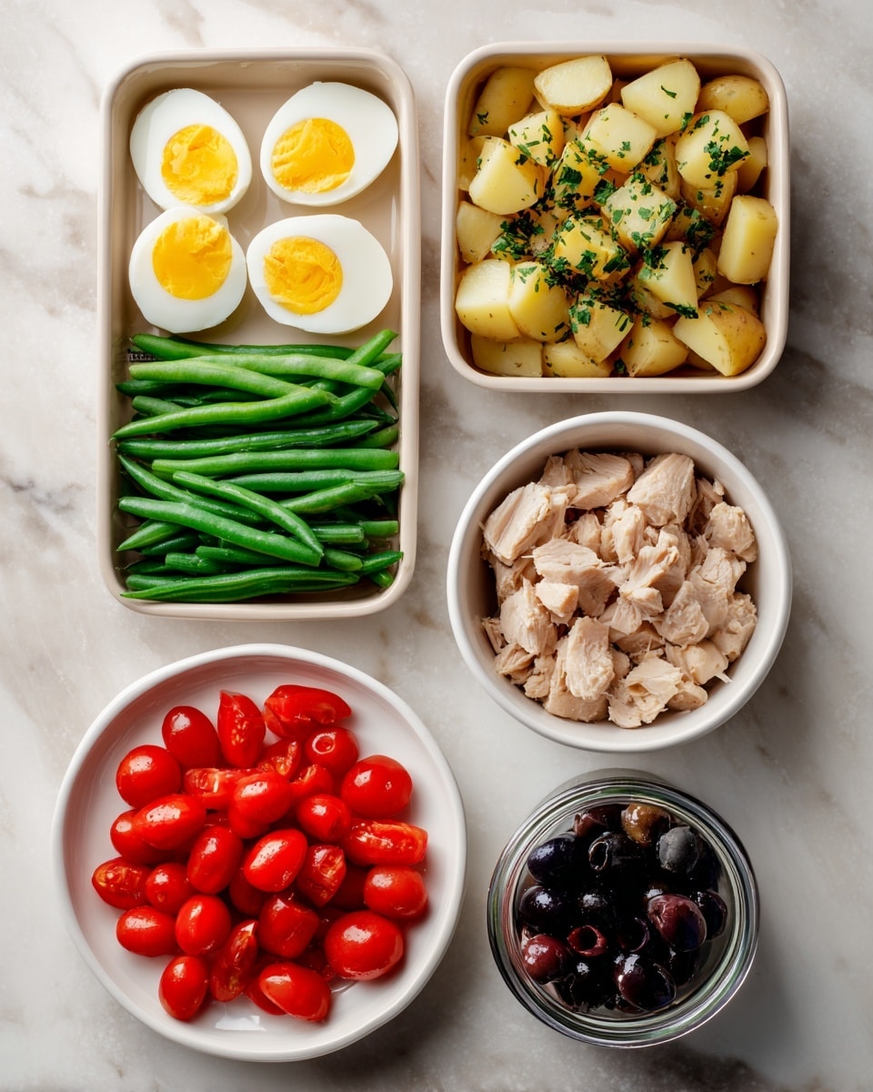 The image shows six containers of food arranged on a white marbled surface. At the top left, there is a rectangular tray with eight halved boiled eggs, showing bright yellow yolks and white edges. Next to it on the right, another rectangular tray holds small diced cooked potatoes sprinkled with green herbs. Below these trays, on the left, a white bowl holds fresh whole green beans, long and smooth. To the right, another white bowl contains chunks of light brown tuna. At the bottom left, a white plate is filled with bright red chopped cherry tomatoes. Finally, at the bottom right, a small glass jar contains shiny black olives. The photo taken with an iphone --ar 4:5 --v 7