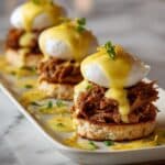 Eggs Cochon with Poached Eggs, Roasted Chicken, and Hollandaise Sauce on Buttermilk Biscuits Recipe