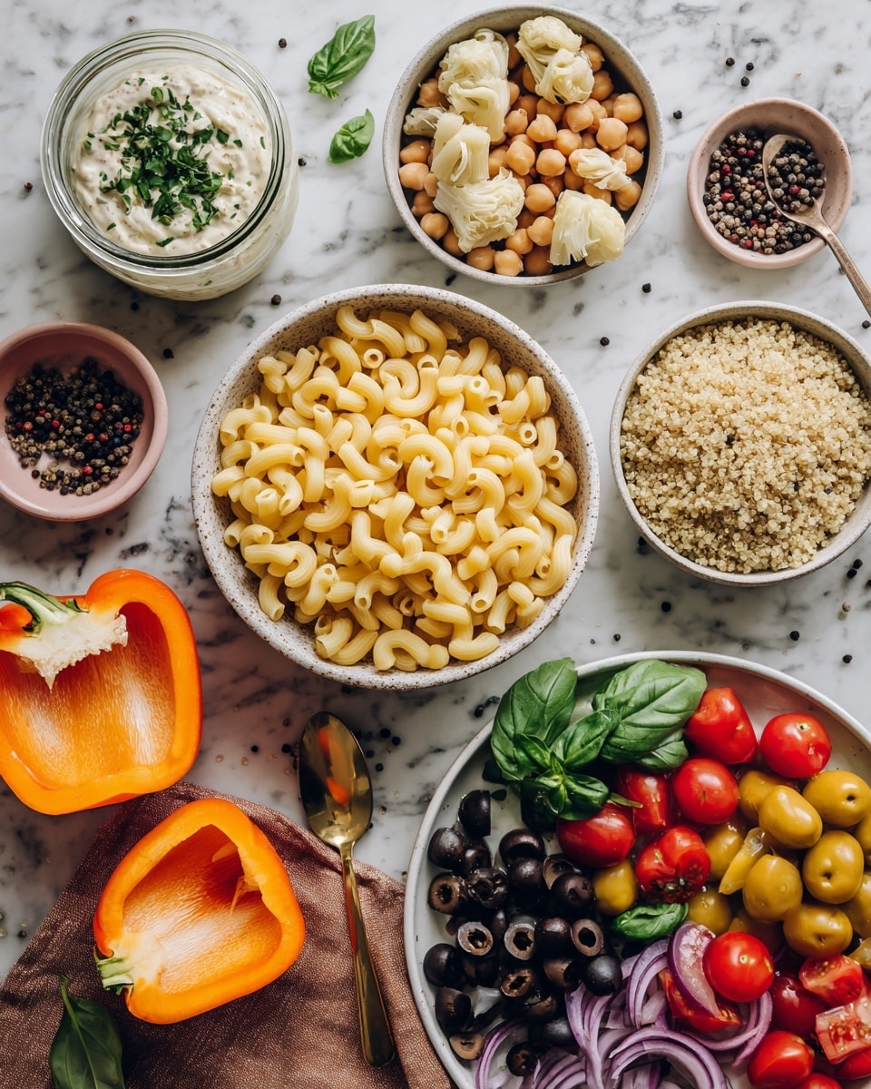 The image shows several bowls and food items arranged on a white marbled surface. In the center, there is a bowl filled with cooked elbow macaroni, light yellow and smooth in texture. To the top left, a glass jar with white creamy sauce garnished with chopped green herbs, beside it is a small white bowl with whole chickpeas, pale beige in color. Next to the chickpeas is a small white bowl with light tan artichoke pieces. On the right side, a white bowl holds crumbled light brown quinoa. Below, a round white plate is filled with mixed vegetables including bright red cherry tomatoes on vine, dark black sliced olives, dark purple sliced onion halves, fresh green basil leaves, and yellow cherry tomatoes. At the bottom left corner, two halves of a bright orange bell pepper are placed on a brown cloth. A small pink bowl containing black peppercorns and a gold spoon appears at the top. Photo taken with an iphone --ar 4:5 --v 7
