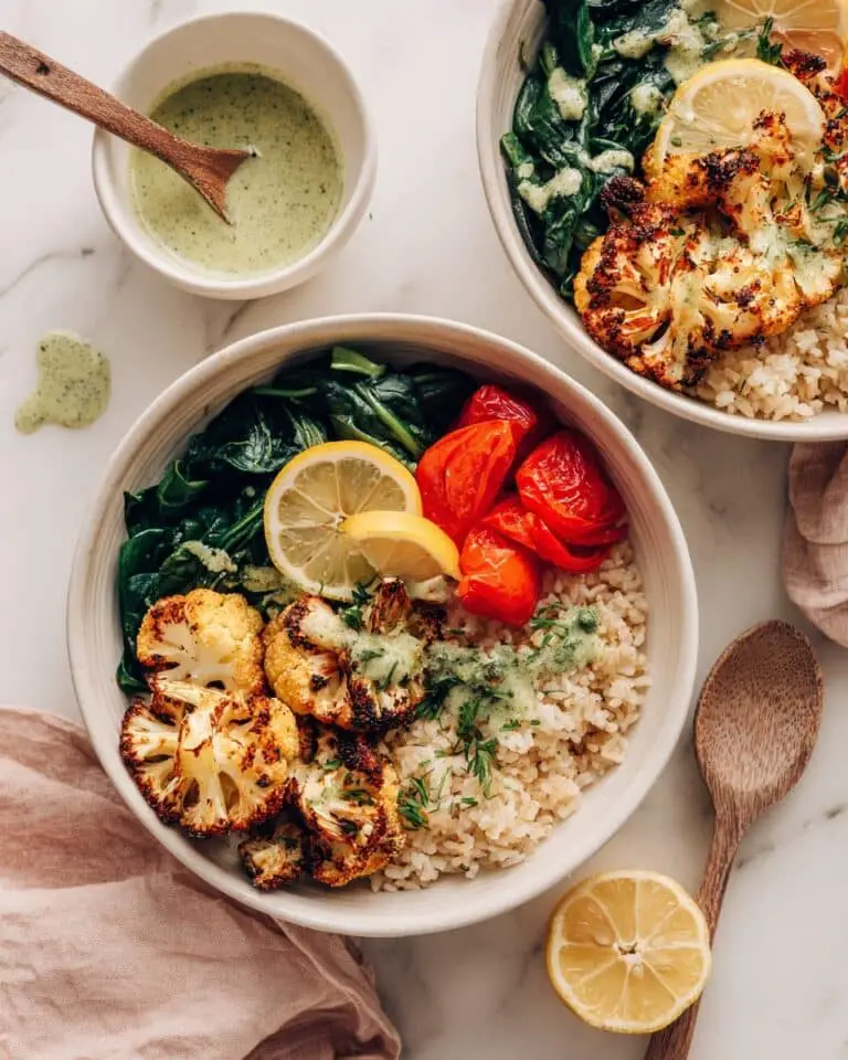 Hearty Vegan Roasted Cauliflower Bowl with Herb-Infused Brown Rice and Avocado Lime Dressing Recipe