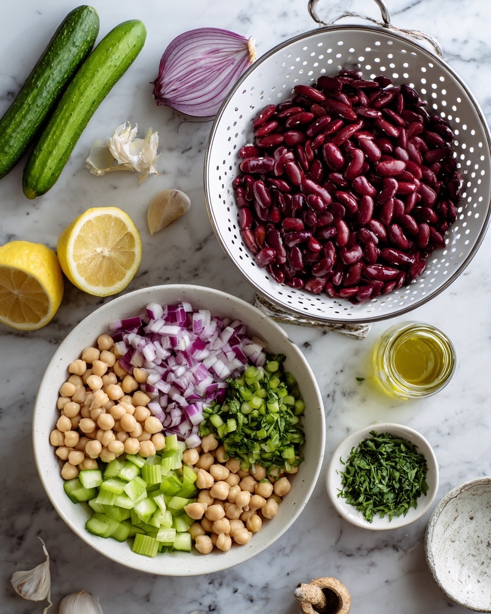 The image shows two parts side by side on a white marbled surface. On the left, a white colander holds two layers of beans: dark red kidney beans covering most of the colander, with light beige chickpeas filling one side. Around it lie fresh ingredients including long cucumber slices, a halved lemon, a halved red onion, garlic cloves, and green herbs. On the right, a white bowl contains four clear sections of chopped ingredients: finely diced purple-red onion, small green cucumber pieces, chopped celery in light green, and a mix of kidney beans and chickpeas at the bottom center. A small bowl of chopped green herbs, a small jar of olive oil, and a lemon half are nearby. Photo taken with an iphone --ar 4:5 --v 7