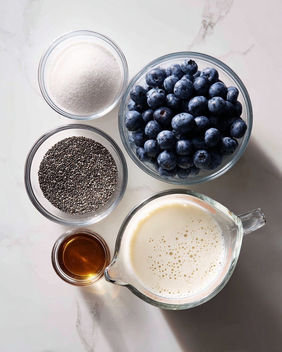 The image shows five clear glass bowls and a measuring cup arranged on a white marbled surface. The top right bowl is filled with a pile of fresh dark blue blueberries with a smooth, round texture. To its top left is a bowl with fine, white granulated sugar. Below the sugar is a small bowl containing dark amber liquid, smooth and clear. Below this is a bowl filled with small, black and white chia seeds that have a rough texture. On the bottom right, a large measuring cup holds creamy white liquid with small bubbles on its surface. The glass containers reflect light softly, creating a clean and fresh look. Photo taken with an iphone --ar 4:5 --v 7