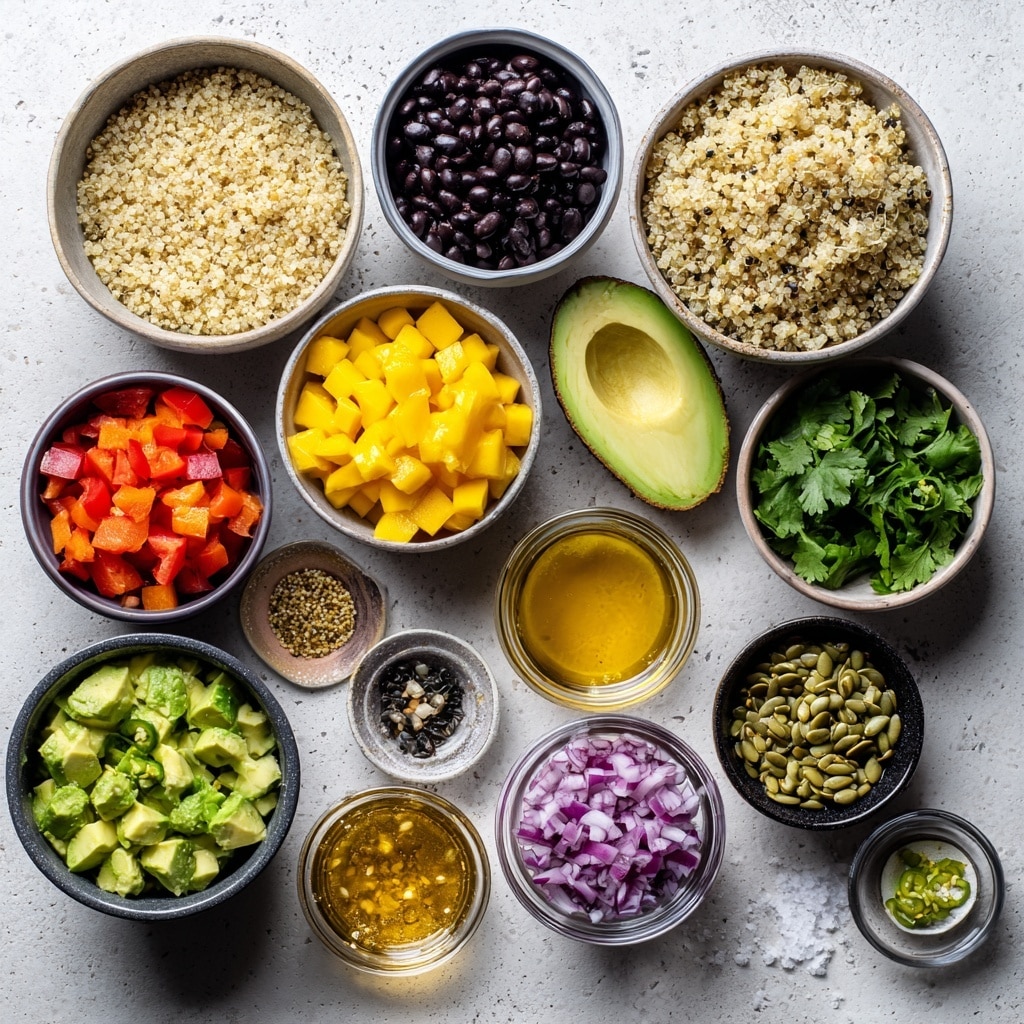 A white bowl is filled with a colorful mix of quinoa, black beans, bright yellow mango cubes, red bell pepper pieces, green avocado chunks, and fresh cilantro leaves scattered on top. The quinoa grains are light beige and form the base layer mixed evenly with the black beans, while the bright yellow mango pieces and red bell pepper add vibrant color contrast, with green avocado and cilantro giving fresh green highlights. A silver spoon with an ornate handle rests inside the bowl, slightly buried in the mixture. Around the bowl, there is a white marbled surface with a lime wedge and dark cloth nearby for decoration. Photo taken with an iphone --ar 4:5 --v 7