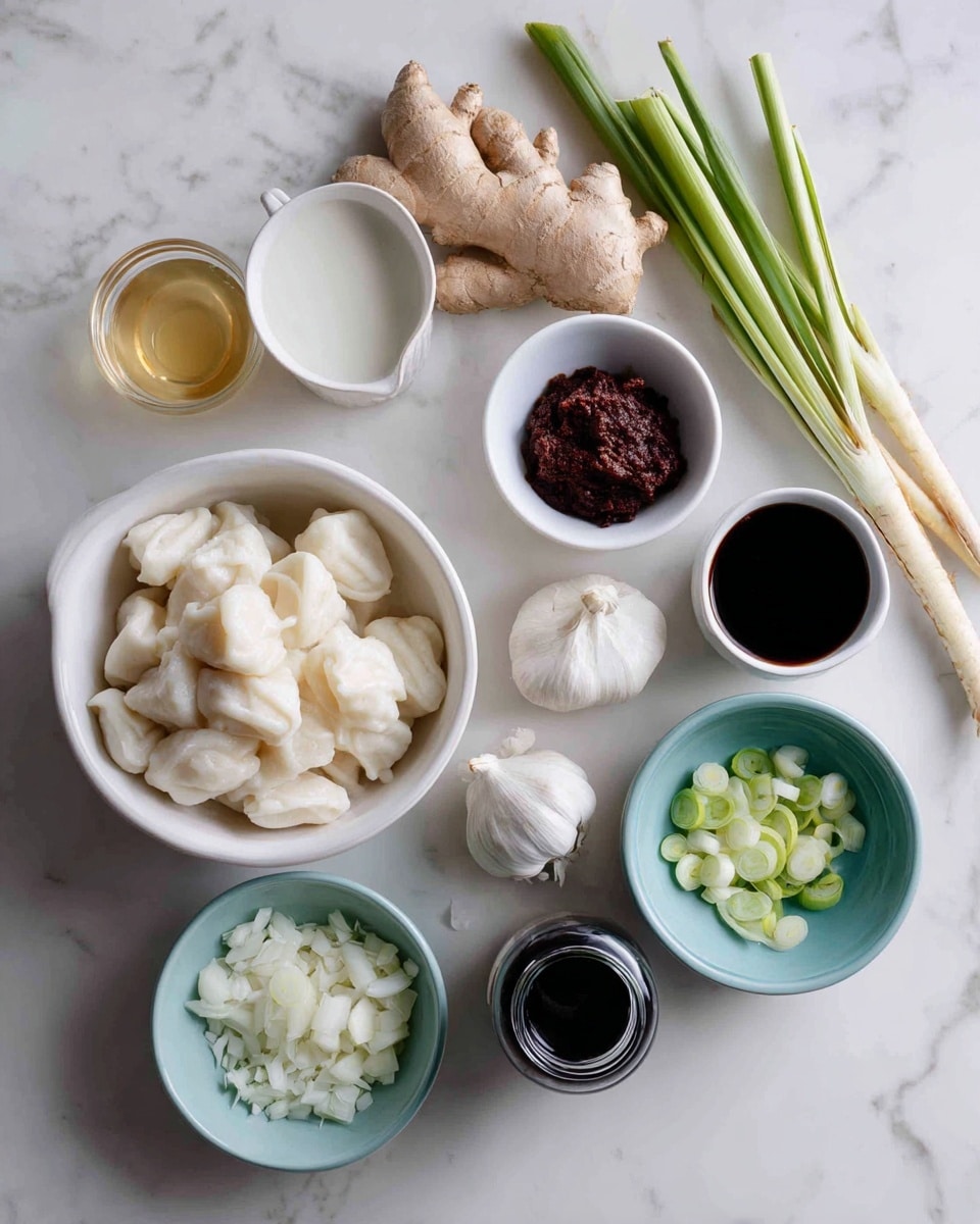 The image shows a flat lay of various cooking ingredients on a white marbled surface. In the lower left corner, there is a white bowl filled with white dumplings. Above the dumplings, a small glass bowl holds a light golden liquid. Next to it, a whole piece of ginger and a stalk of lemongrass lie side by side. Above them, there is a large white bowl filled with a white liquid. To the right of the large bowl, a small white bowl contains a thick dark red paste. Below that, three garlic cloves rest in a small white bowl. Next to the garlic, a light blue bowl contains finely chopped white onions, and in front of it, a white bowl holds sliced green onions. Finally, on the bottom right, there is a small white jar filled with dark soy sauce. The whole composition is simple and clean, arranged neatly for a cooking setup, photo taken with an iphone --ar 4:5 --v 7