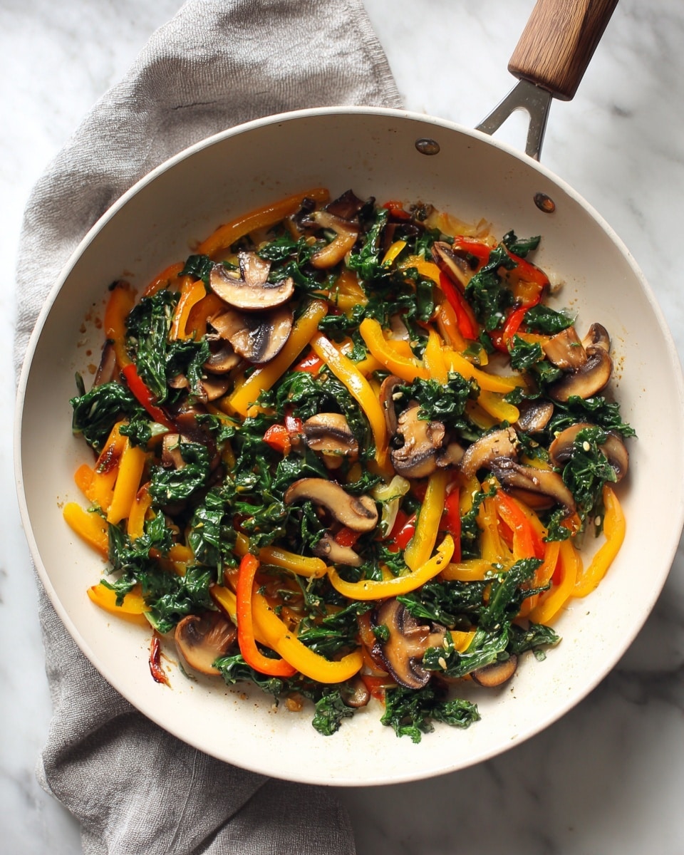 The image shows a white frying pan filled with cooked sliced mushrooms, bright orange and yellow bell pepper strips, and chopped dark green leafy vegetables mixed together. The vegetables are spread evenly in the pan with a slight glossy texture from cooking oil, and the mushrooms add a soft beige and brown contrast beneath the colorful peppers and greens. The pan sits on a white marbled surface with a grey and white folded cloth partially visible under the handle, and the scene is well-lit, highlighting the fresh look of the vegetables. photo taken with an iphone --ar 4:5 --v 7