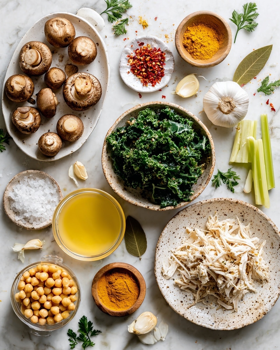 The image shows a white marbled surface with arranged ingredients: a white oval plate filled with whole brown mushrooms on the upper left, a small white dish with red chili flakes near the top left edge, and fresh green kale leaves in a round bowl near the center. To the right of the kale bowl are peeled garlic cloves in a small bowl, a whole bulb of garlic, and three stalks of light green celery extending from the middle right edge. Near the bottom right corner is a white speckled plate with shredded white chicken. Below the kale bowl are two fresh orange carrots and a small white bowl with a small amount of yellow turmeric powder. To the left of the turmeric bowl are two bay leaves and a small wooden bowl filled with coarse salt. On the lower left side of the image are a bowl of yellow chickpeas and a clear glass container filled with light yellow broth. Two halves of a white onion are placed near the center left side. Scattered small green parsley leaves add a touch of color around the composition. All items are displayed on the white marbled surface with soft natural light, photo taken with an iphone --ar 4:5 --v 7
