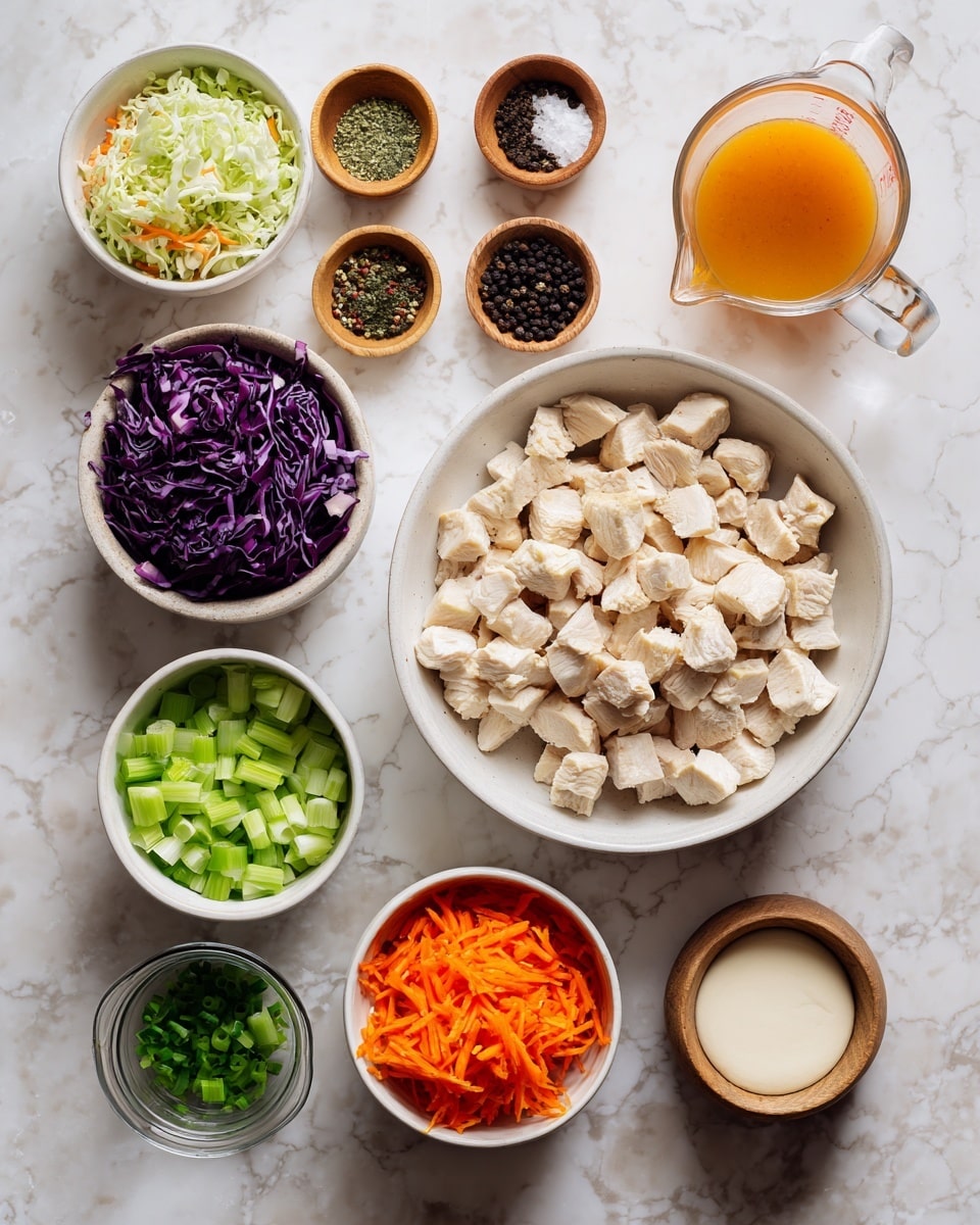 The image shows a top view of various ingredients laid out on a white marbled surface. There is a large white bowl filled with chopped cooked chicken cubes in the center. To the upper left, a white bowl contains mixed shredded cabbage including green, purple, and orange pieces. Above the chicken bowl, three small wooden bowls hold whole black peppercorns, coarse salt, and dried herbs respectively. To the upper right, a clear glass measuring cup holds orange sauce. Below that, a white bowl contains finely diced green celery. At the bottom left, a small glass jar has chopped green onions, next to it a small clear bowl filled with a light brown liquid. Near the bottom, another white bowl contains shredded orange carrots. To the lower right, a small wooden bowl holds a light beige powder. Beside it, a small white bowl (placed inside an orange dish) displays a thick white creamy substance. The arrangement is neat with all bowls and containers clearly showing their colorful contents, presented on a clean white marbled background. Photo taken with an iphone --ar 4:5 --v 7