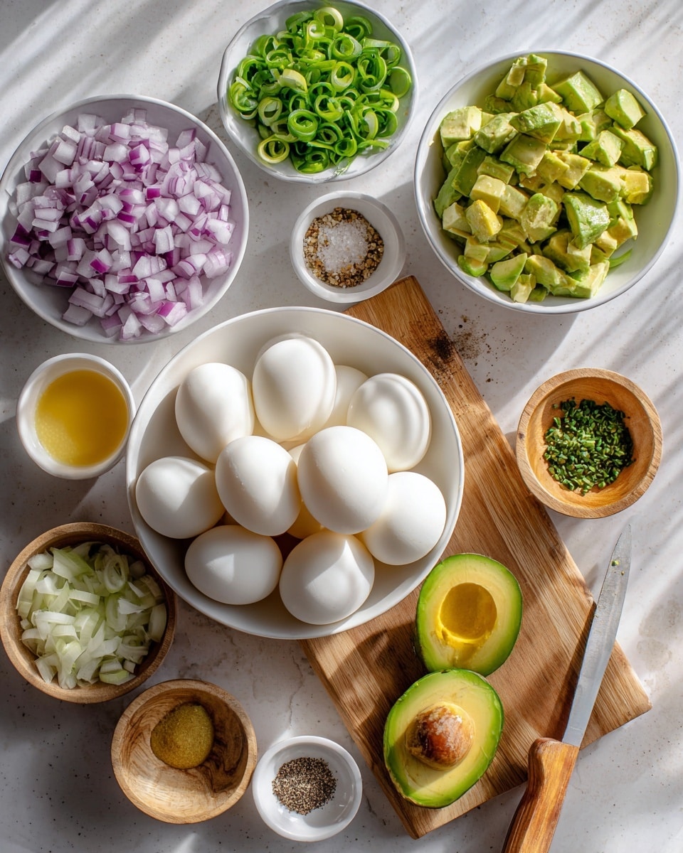 The image shows a collection of fresh ingredients arranged neatly on a white marbled surface. In the center, there is a white bowl filled with nine peeled, smooth, white hard-boiled eggs. To the top right of the eggs is a white bowl holding diced, bright green avocado pieces. Two avocado halves, one with the seed, lie nearby on the surface. Above the eggs, a small wooden bowl contains sliced green onions with round shapes and a fresh green color. Next to that, a small white bowl holds a swirl of coarse salt and black pepper. To the far left, a white cutting board displays finely chopped red onions with a slight purple hue, and diced pale green pickles; a knife with a wooden handle rests on the board. Above the board, a white bowl is filled with finely chopped chives, showing a dense green texture. A small wooden bowl of mustard yellow sauce and another wooden bowl with creamy white sauce complete the arrangement. The lighting is bright and natural, highlighting the fresh and colorful ingredients. Photo taken with an iphone --ar 4:5 --v 7