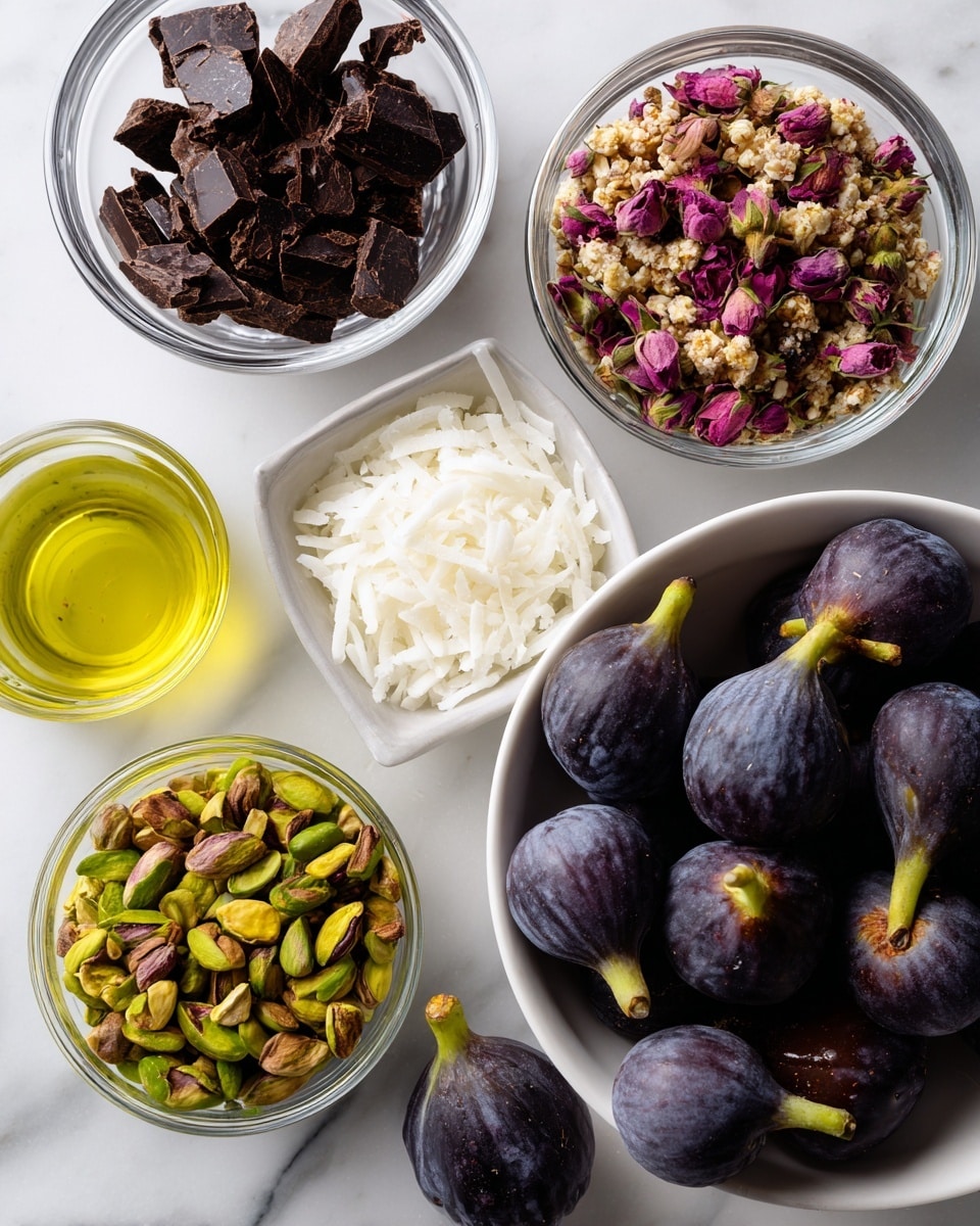 The image shows several halves of figs placed on a white marbled surface. Each fig half has three layers: the top layer is a mix of crushed pistachio nuts and small pink flower petals, the middle layer is smooth dark chocolate coating half the fig, and the bottom layer is the soft, light pink interior of the fig with seeds visible. The figs are arranged close together in the picture. photo taken with an iphone --ar 4:5 --v 7