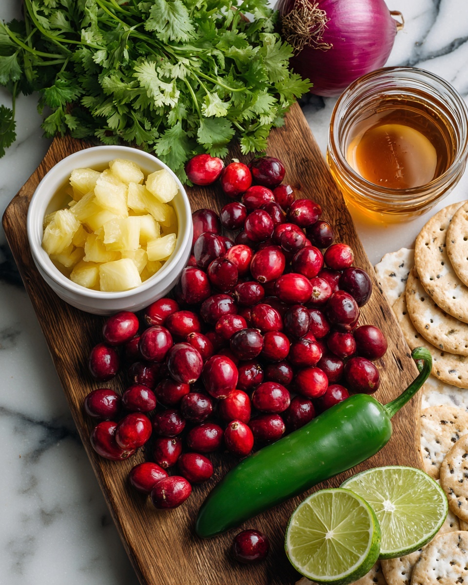 A rustic wooden board sits on a white marbled surface, overflowing with bright red cranberries that show a mix of shiny smooth and slightly matte textures. At the front is a glossy green jalapeño pepper with a curved stem. To the left, a white bowl filled with small, bright yellow pineapple chunks offers a vibrant contrast. Behind the cranberries, a bunch of fresh green cilantro leaves spreads outward with delicate, lacy edges. Near the top right, a round purple-red onion with a papery outer layer adds depth in color. Two halves of a bright green lime are placed on the left side, showing their juicy, segmented interiors. On the far right, a clear glass jar contains amber honey, next to a few light tan crackers with black and white seeds visible. The whole setup looks fresh and colorful against the white marbled background photo taken with an iphone --ar 4:5 --v 7